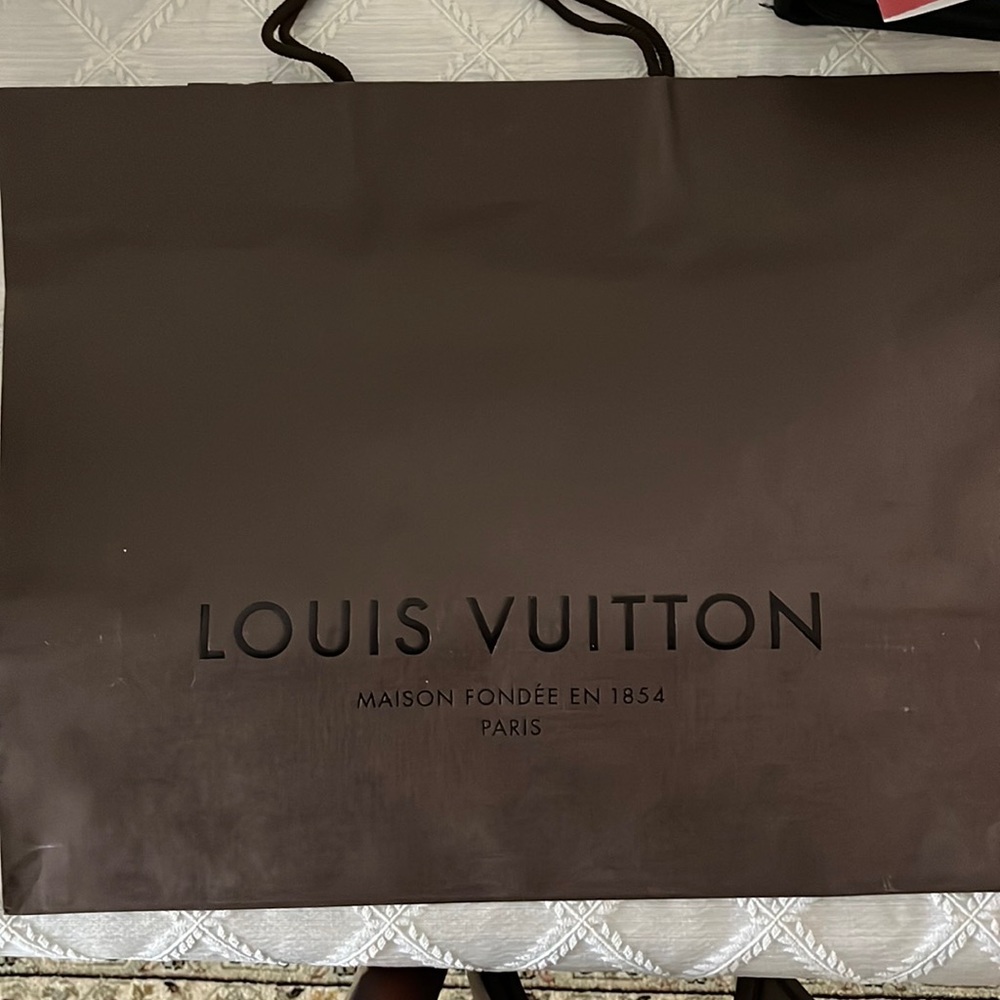 Large Louis Vuitton shopping bag.